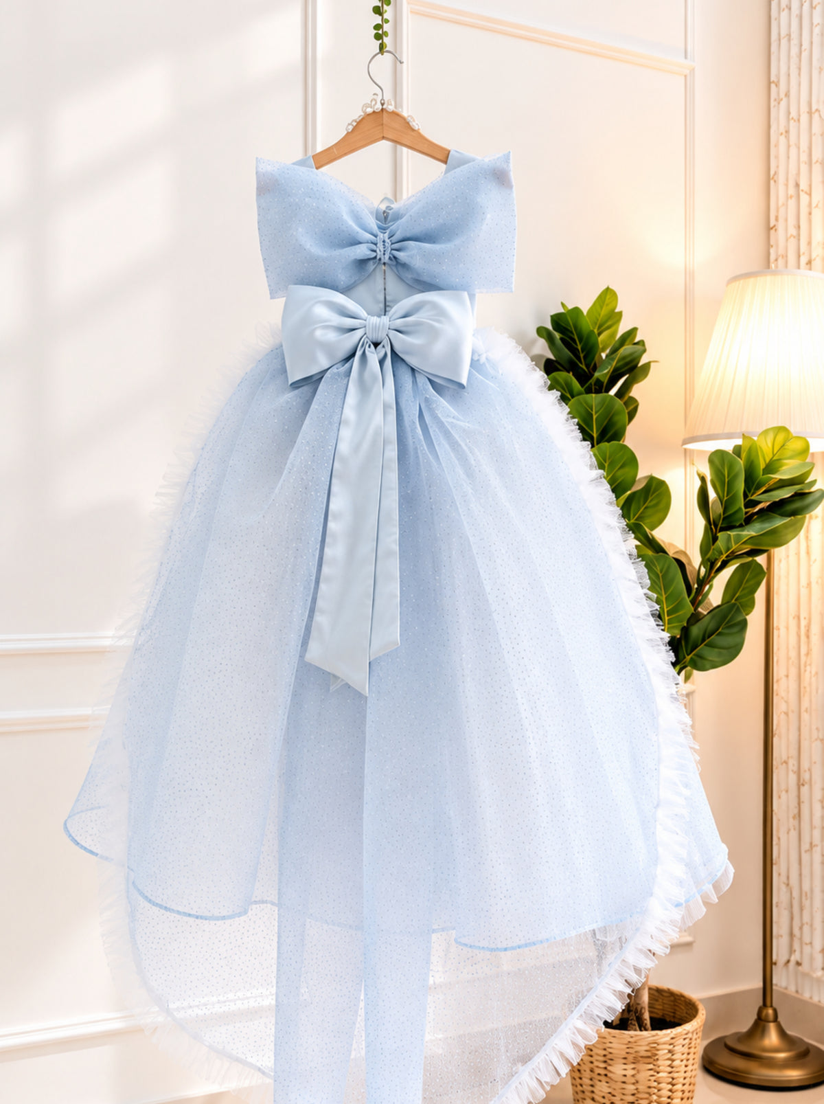 Back view of Elsa inspired blue princess gown with shimmering net skirt and elegant princess silhouette