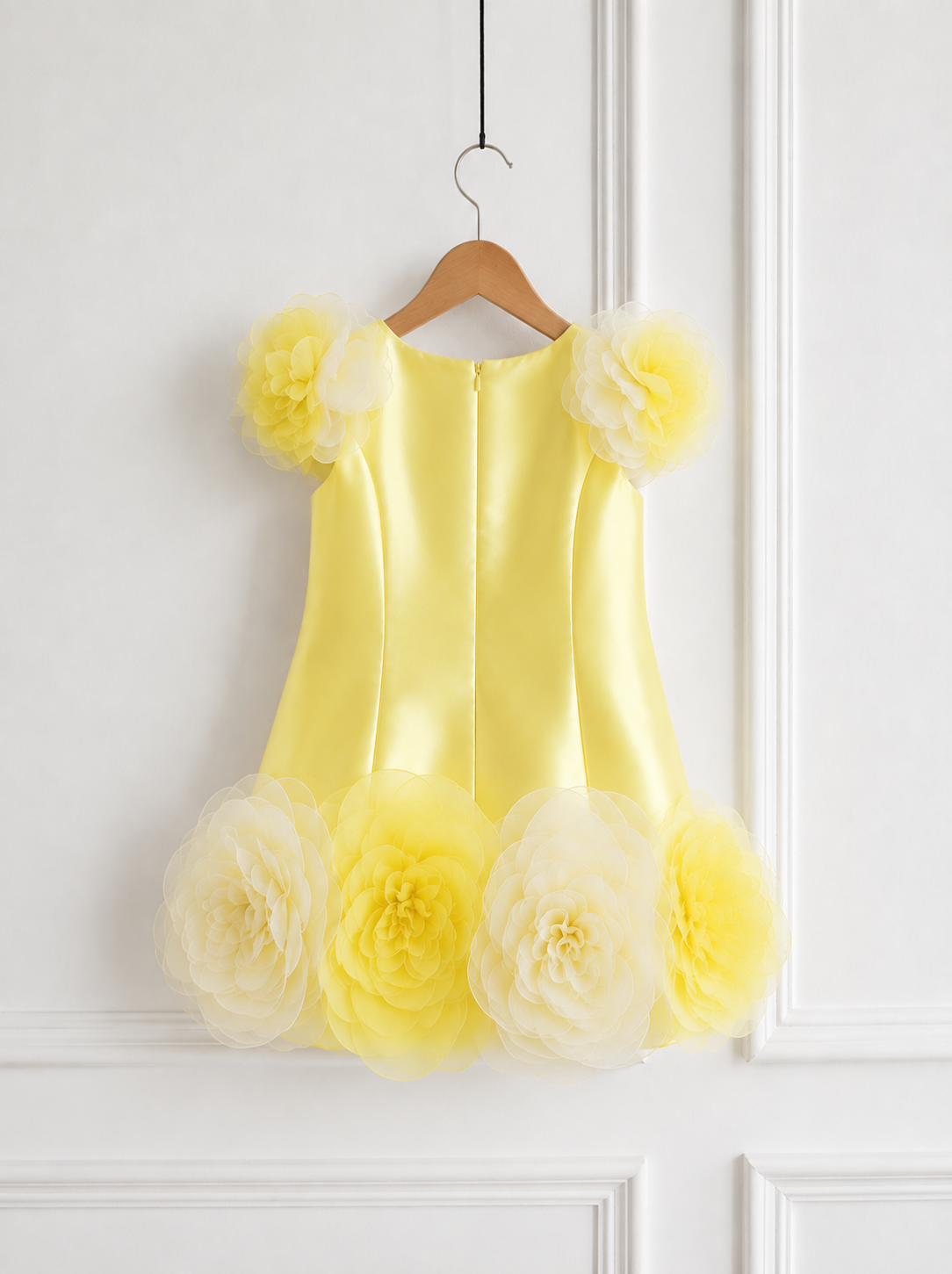 Designer lemon yellow first birthday dress for baby girl with oversized handcrafted organza flowers, premium satin fabric, elegant A-line silhouette, and luxury couture finish.