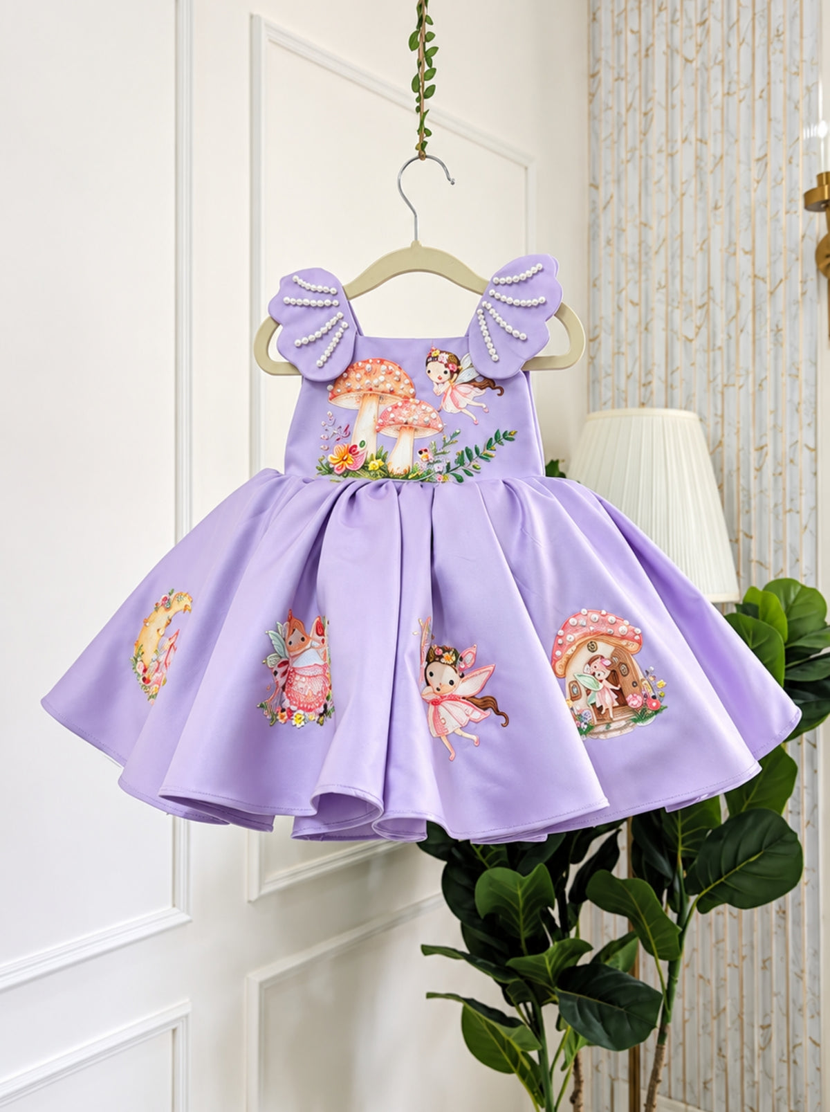 the lavender fairy birthday dress for girls by Lauren Ann. Featuring Duchess Satin, magical fairy prints and hand-embellished pearl details. Perfect for birthdays and photoshoots.