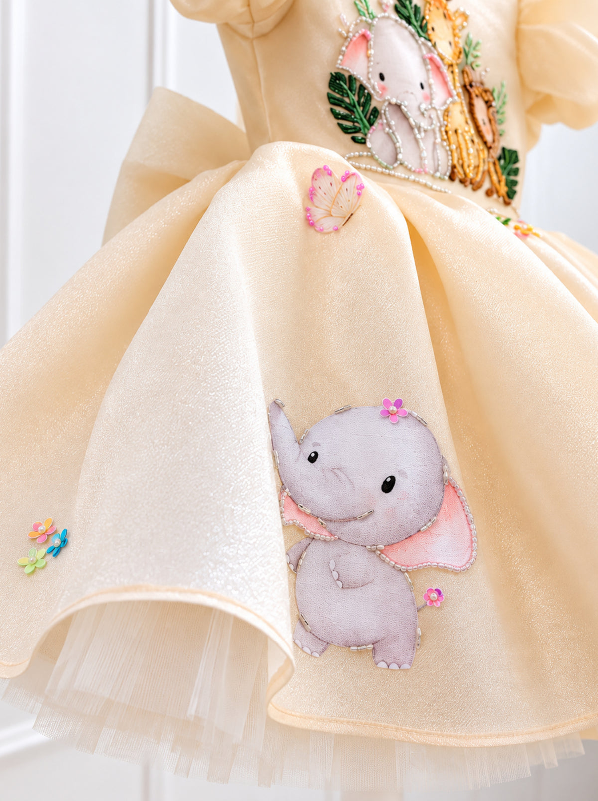 Hand-embellished elephant animal detail on cream Duchess Satin girls birthday dress