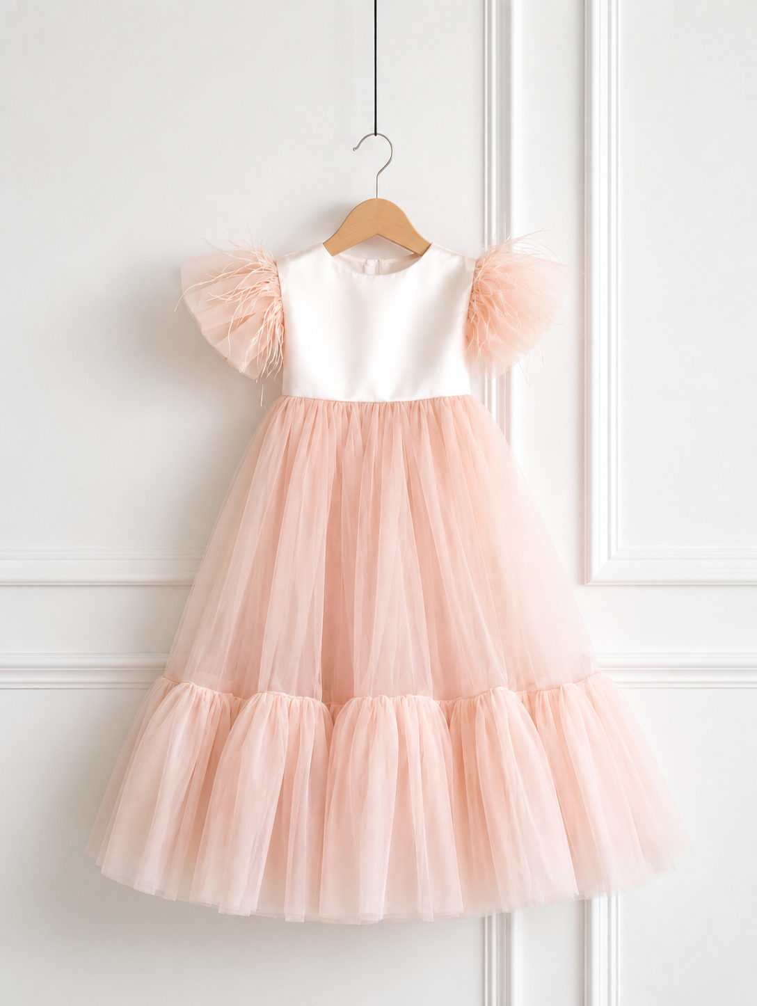 Blush pink tulle birthday dress for girls with off-white satin bodice and feather sleeves by Lauren Ann