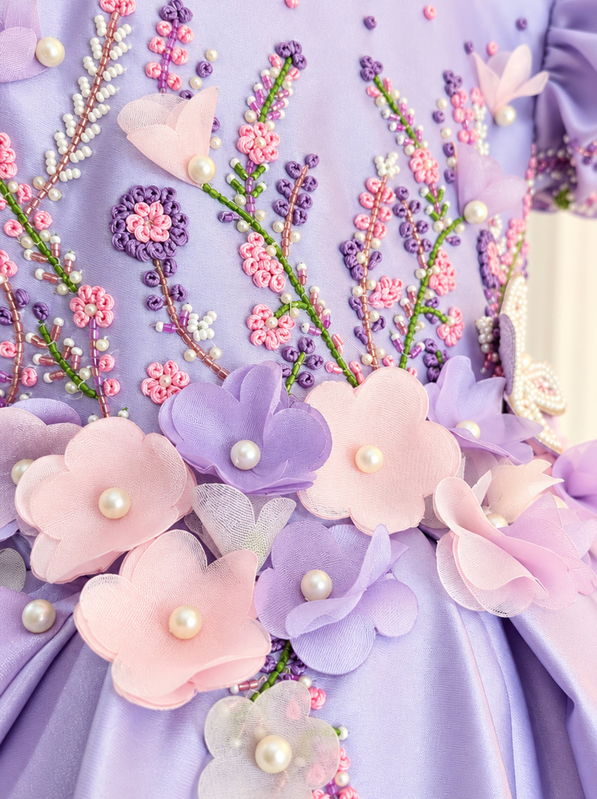 Lavender flower girl dress with pastel floral appliques, pearl embellishments and detailed beadwork