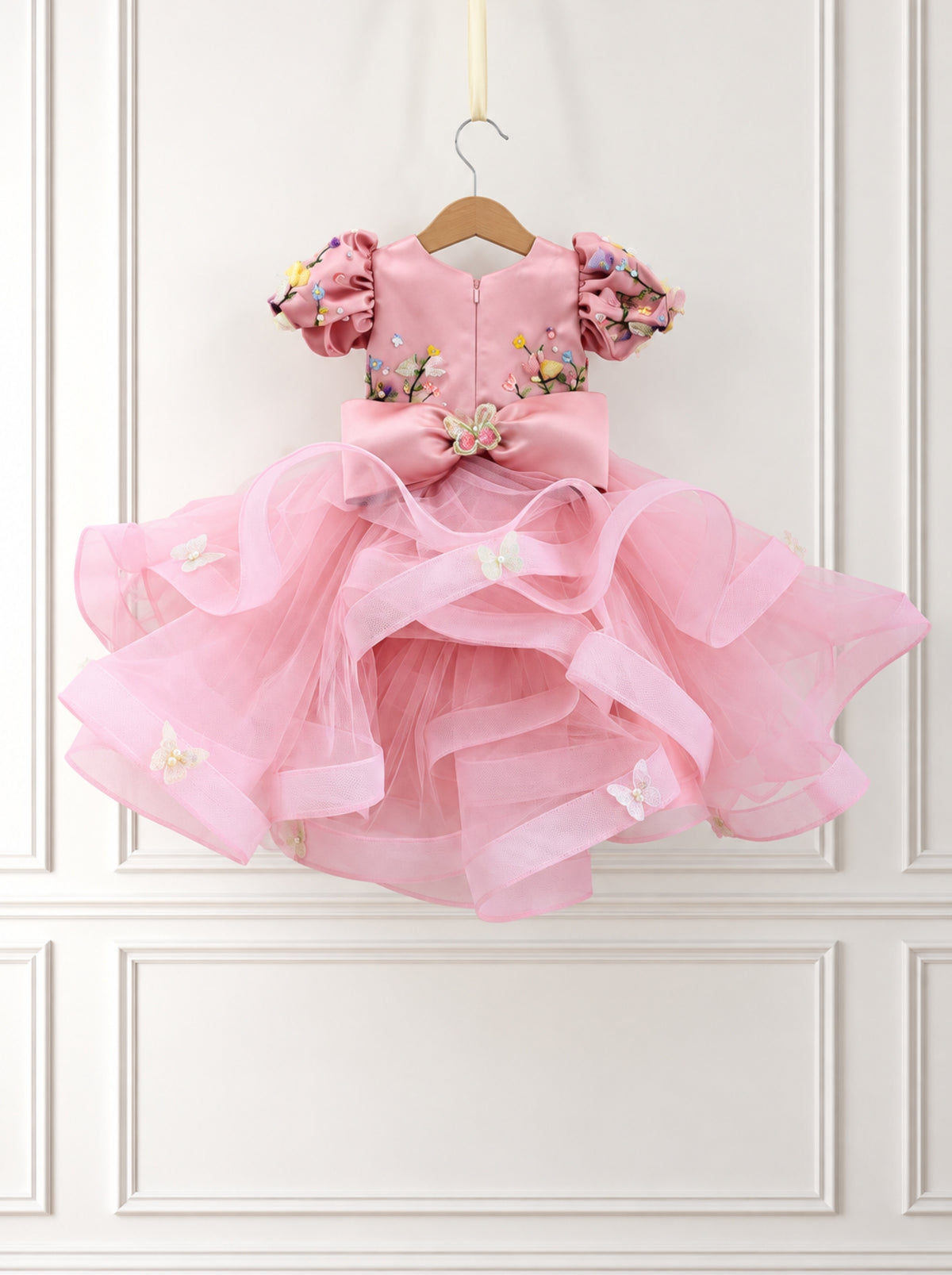 Back view of pink satin and tulle birthday dress for girls with large satin bow